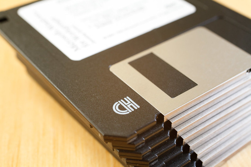 One way in which an organisation enforces security of its computer systems is by restricting the use of removable media such as floppy disks and flash memories. Give two reasons for this.