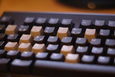 List four types of keys found on a computer keyboard. Give an example of each